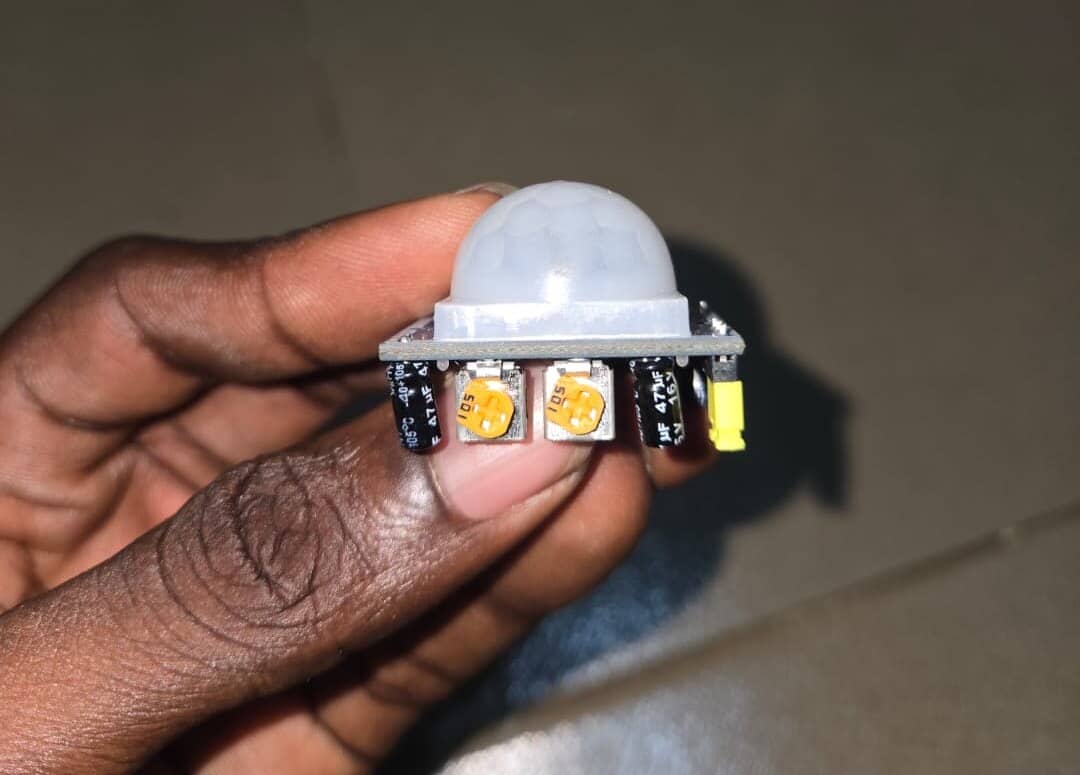 The PIR sensor with its two potentiometers, sensitivity and delay, both turned all the way up